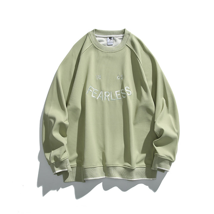 Unisex Oversize-Sweatshirt mit Raglanärmeln und markantem FEARLESS-Frontprint Drune