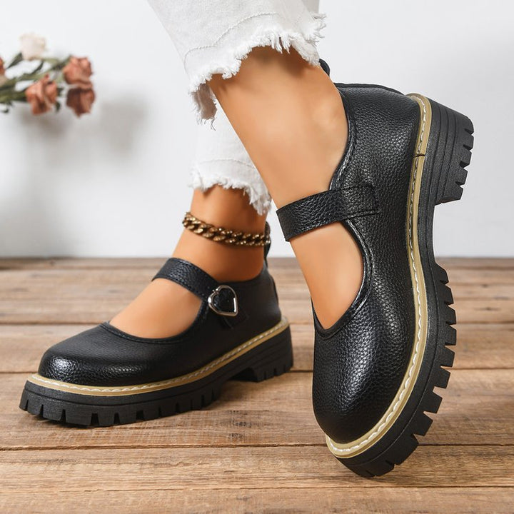 Damen Riemchen‑Slipper im Mary‑Jane‑Stil mit grober Profilsohle und Herzschließe Drune