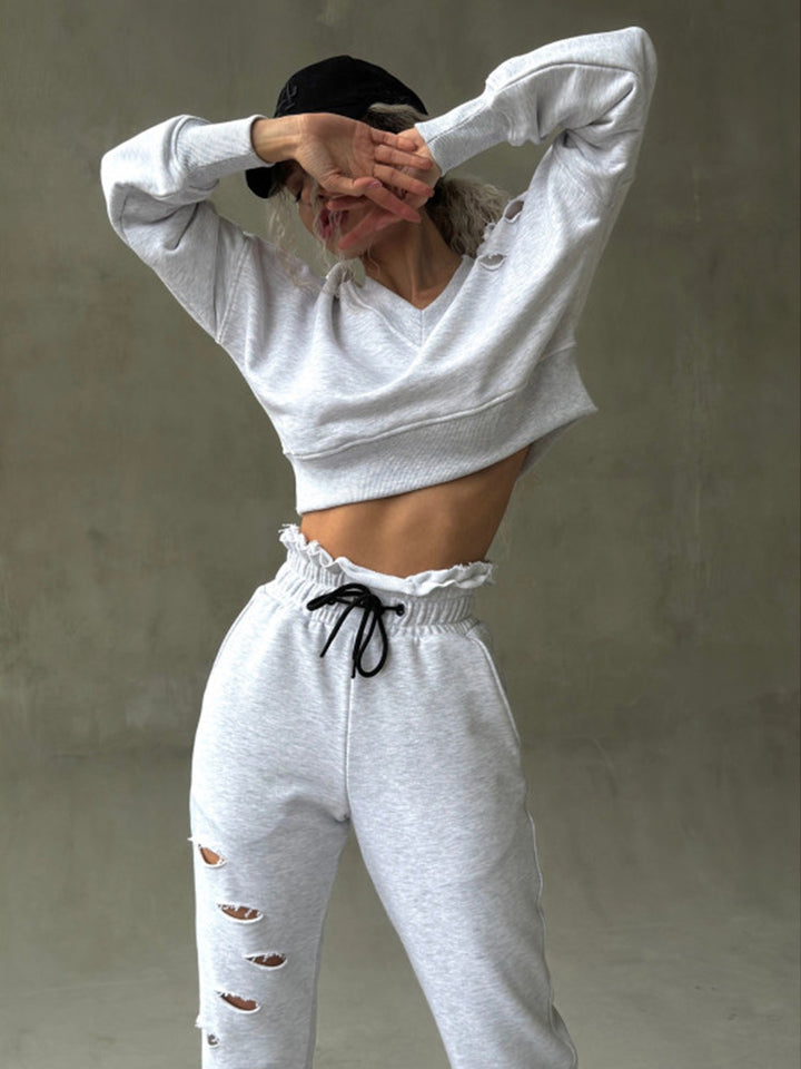 Damen kurzgeschnittenes Sweat-Set mit V-Ausschnitt, Rüschenbund Highwaist Jogginghose und Distressed-Details Drune