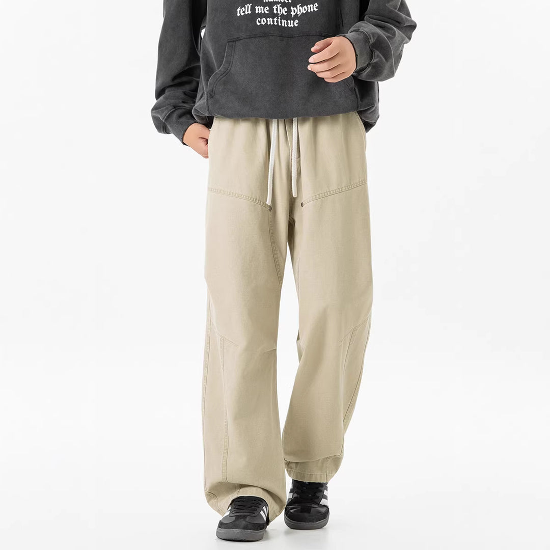 Herren weite Baggy-Cargohose aus gewaschenem Canvas mit Elastikbund und dekorativen Nahtpaneelen Drune