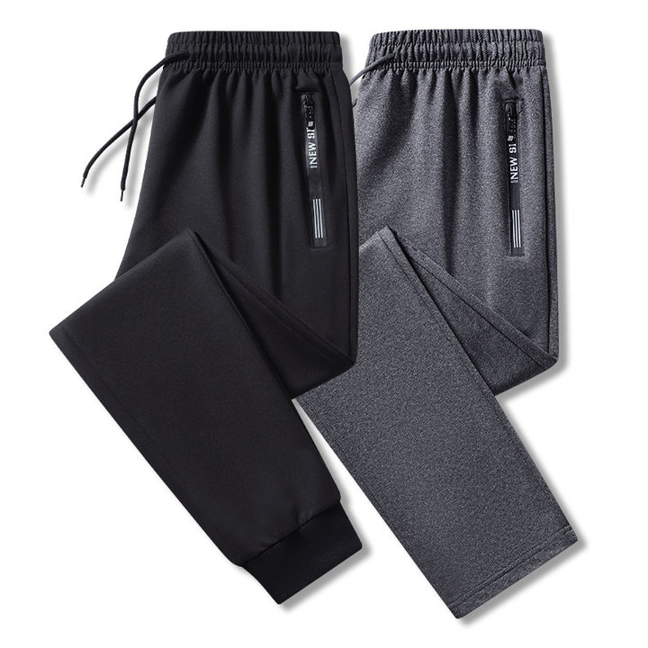 Herren Sportliche Trainingshose mit elastischem Tunnelzugbund, Reißverschlusstasche und glattem Performance‑Material Drune