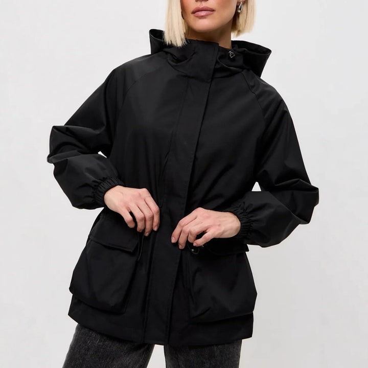Damen wasserdichte Parka-Jacke mit Kapuze, Tunnelzugtaillierung und XXL-Klappentaschen Drune