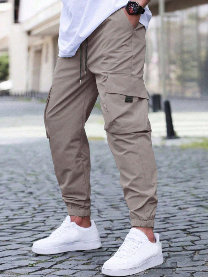 Herren technische Travel-Joggerhose mit integriertem Sicherheitsfach elastischem Tunnelzugbund und wasserabweisender Beschichtung Drune