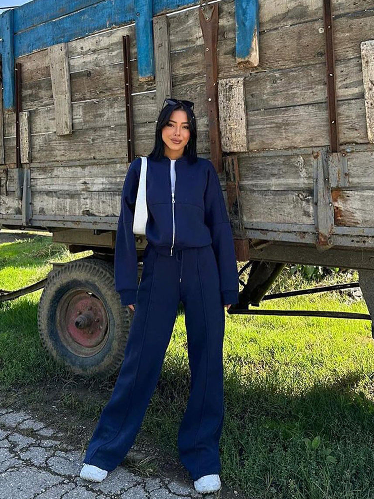 Damen sportive Oversize-Fleecejacke mit diagonaler Reißverschluss-Optik und weit geschnittener High-Waist-Jogginghose Drune
