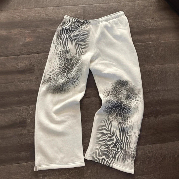Damen nan lockere Sweathose mit asymmetrischem Animal-Print, elastischem Komfortbund und geradem Bein Drune