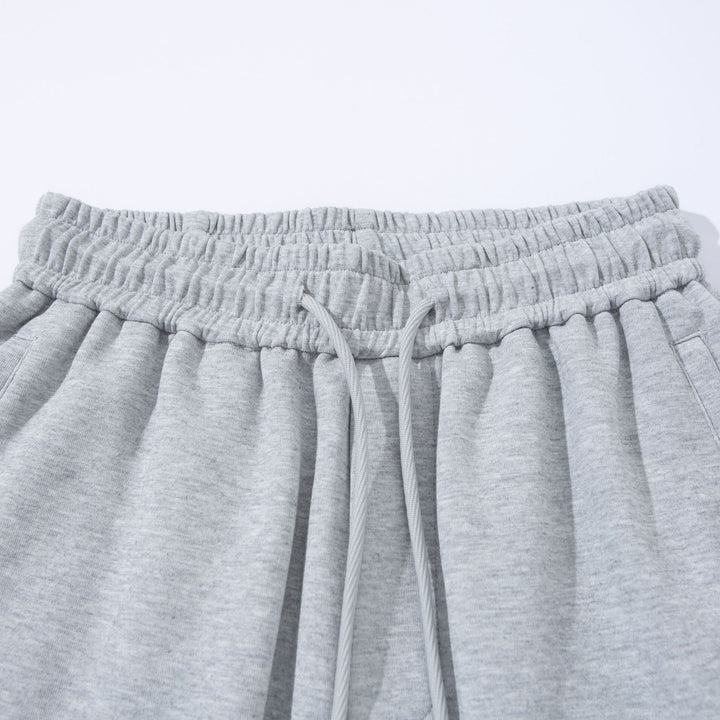 Unisex Weite French‑Terry Sweatpant mit elastischem Tunnelzugbund, Seitentaschen und verstellbarem Saum Drune