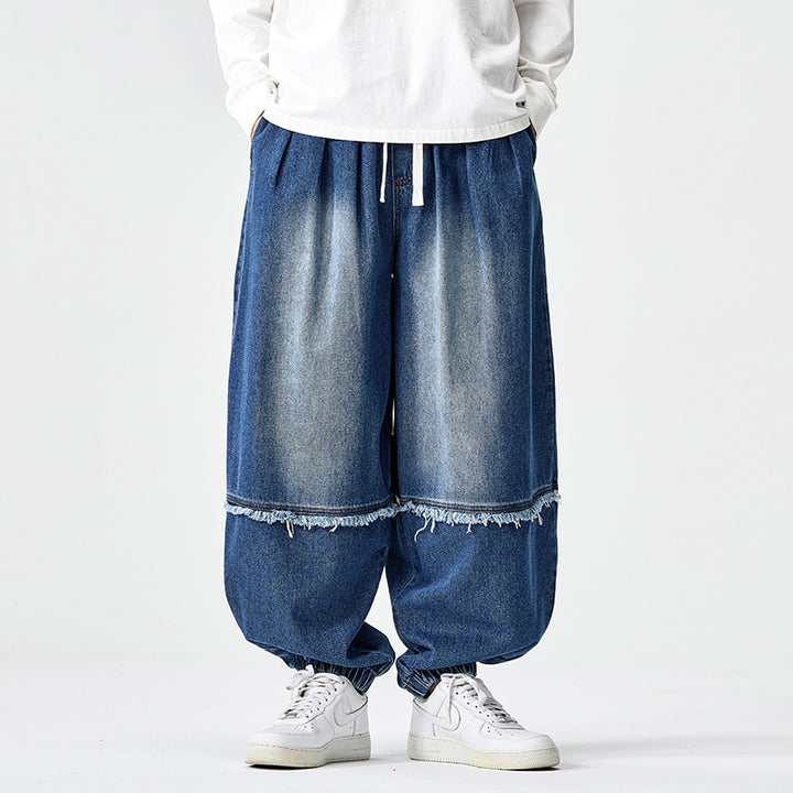 Herren Weit geschnittene Baggy-Denim-Hose mit Tunnelzug, elastischen Beinabschlüssen und Fransen-Detail Drune