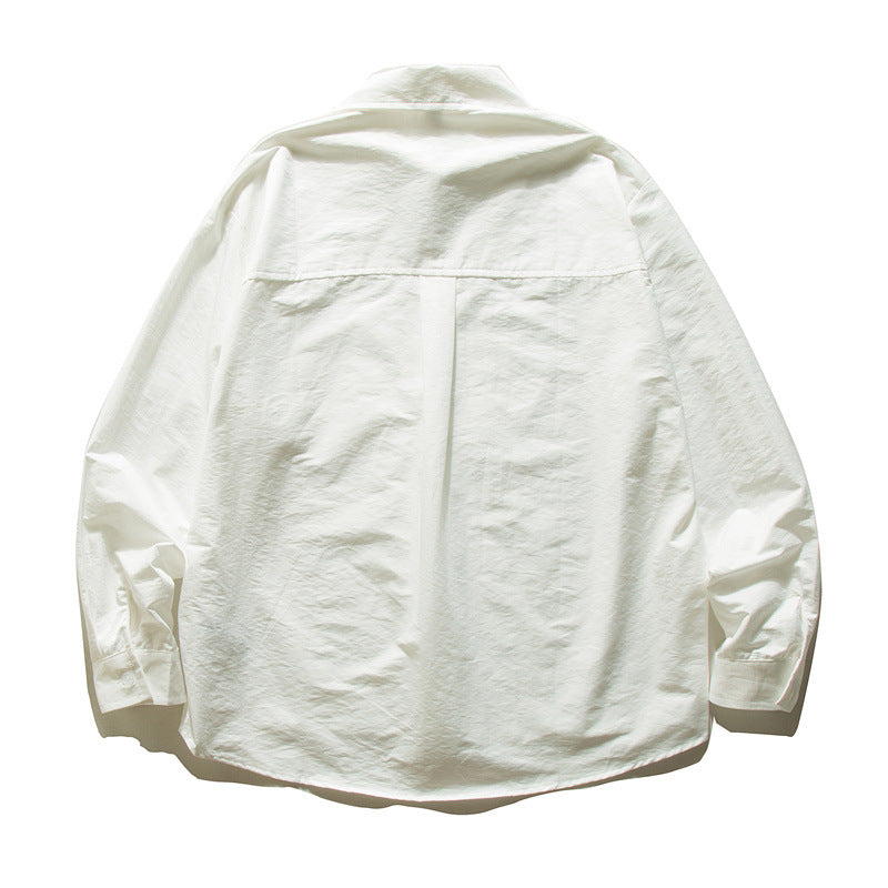 Unisex Oversize Baumwollhemd mit kastigem Schnitt, Brusttasche und abgerundetem Saum Drune