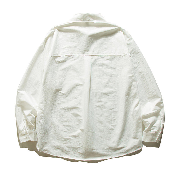Unisex Oversize Baumwollhemd mit kastigem Schnitt, Brusttasche und abgerundetem Saum Drune