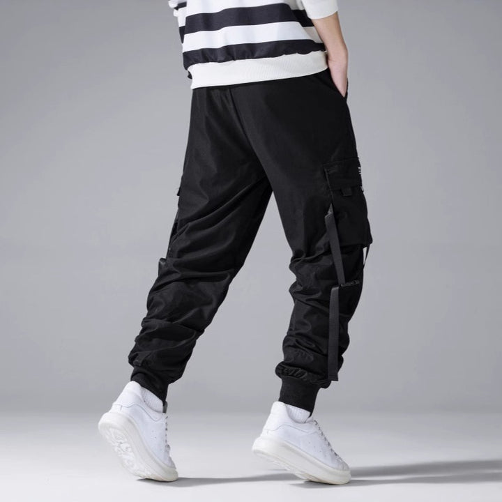Herren Tech‑Cargo‑Jogger mit taktischen Klappentaschen, verstellbaren Nylonriemen und elastischem Knöchelsaum Drune
