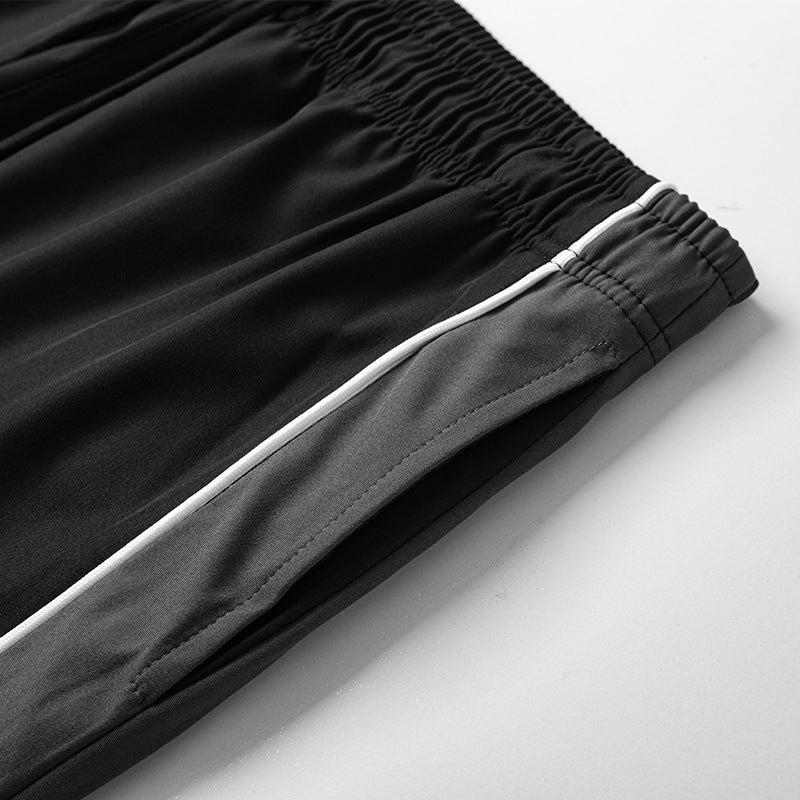 Herren Leichte Trainingshose im Relaxed-Fit mit elastischem Tunnelzugbund und kontrastseitiger Paspel Drune