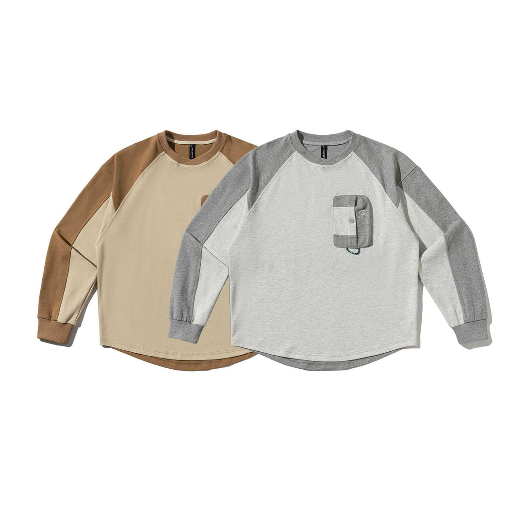 Unisex Raglan‑Sweatshirt mit halbrundem Saum und aufgesetzter Brusttasche Drune