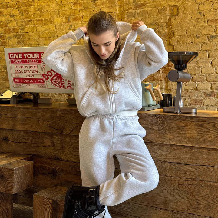 Damen Cropped Kapuzen-Sweatjacke mit Kängurutasche und tailliertem Rippbund Drune