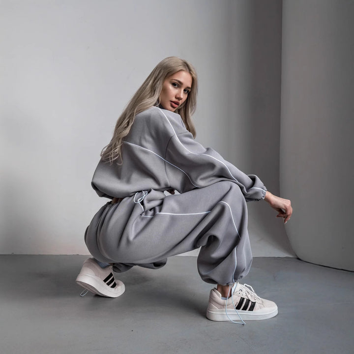 Damen cropped Zip-Kapuzenjacke mit Tunnelzug-Bund, oversized Ärmeln und kontrastierender Paspel Drune