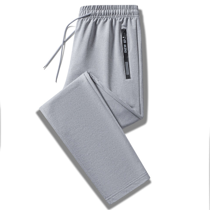 Herren Sportliche Trainingshose mit elastischem Tunnelzugbund, Reißverschlusstasche und glattem Performance‑Material Drune