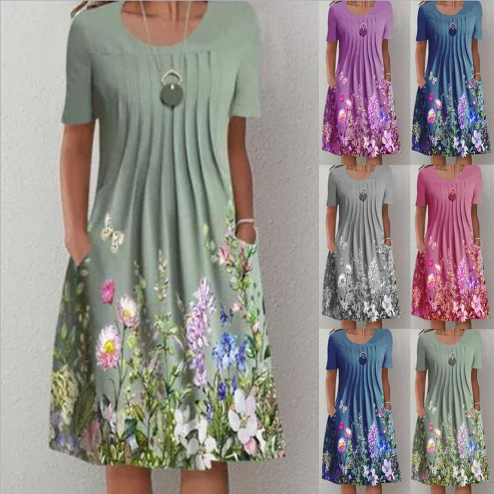 Damen Plissee Midi Kleid mit kurzen Ärmeln, seitlichen Taschen und floralem Saum Drune