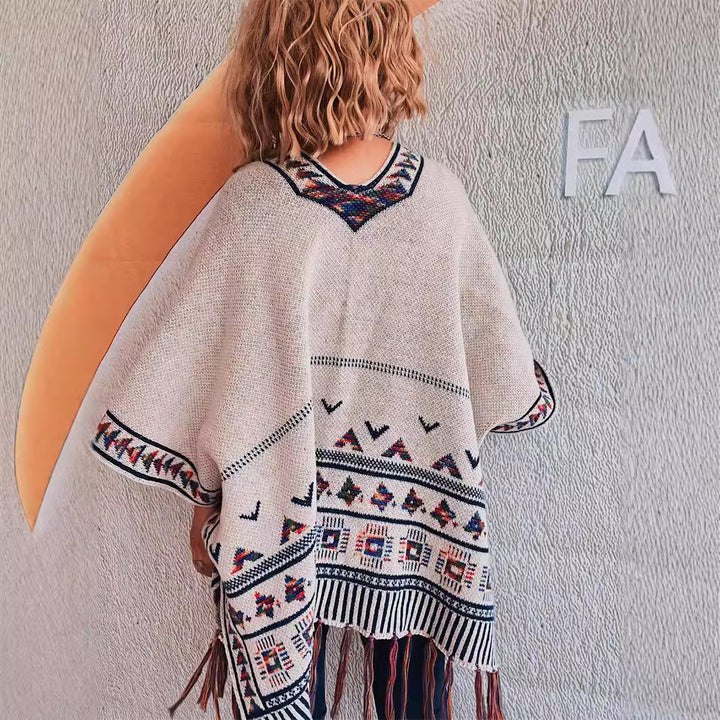 Damen modische Strickponcho mit fransenverzierter Kante und buntem Muster Drune