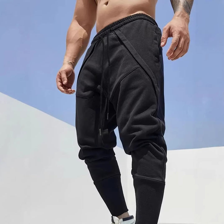 Herren Tapered-Jogginghose mit tiefem Schritt, elastischem Bund & diagonalgesetzten Taschen Drune