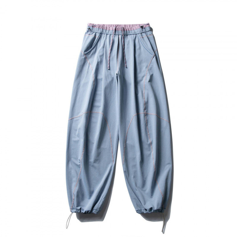 Unisex Locker geschnittene Tech-Jogginghose mit elastischem Bund, markanten Flatlock-Nähten und Kordelzug Drune