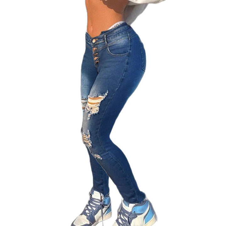 Damen formende High-Waist Skinny-Jeans mit asymmetrischen Rissen und Fransenpatch Drune