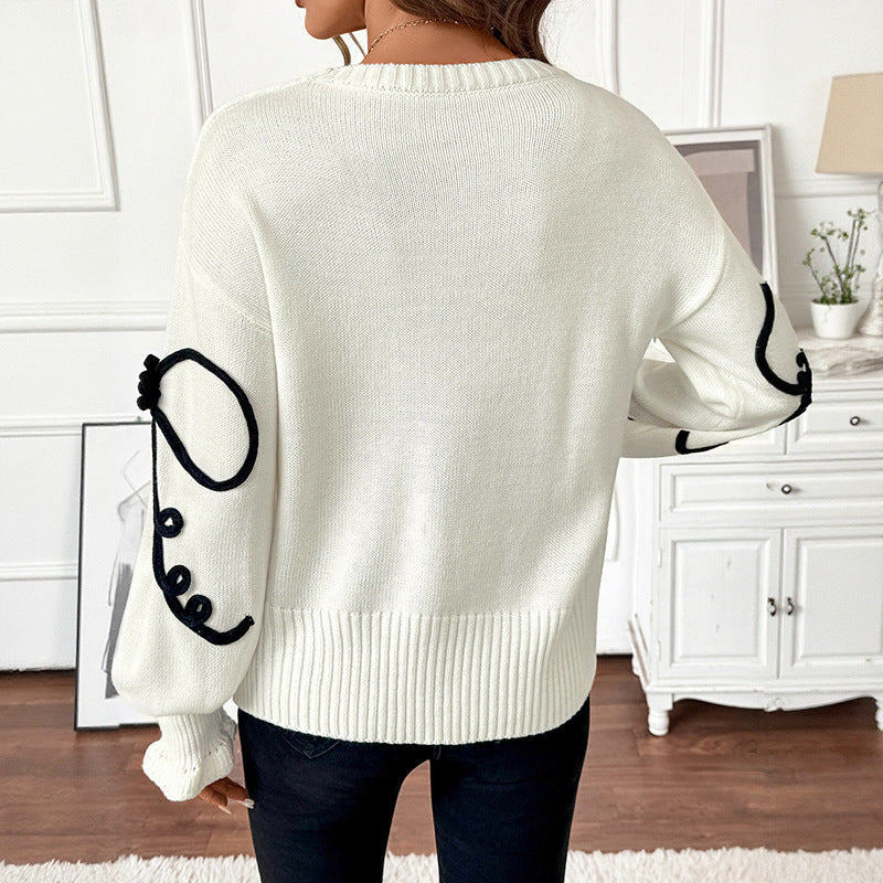 Damen Strickpullover mit kontrastierter Kordelblumenapplikation und Rippbündchen Drune