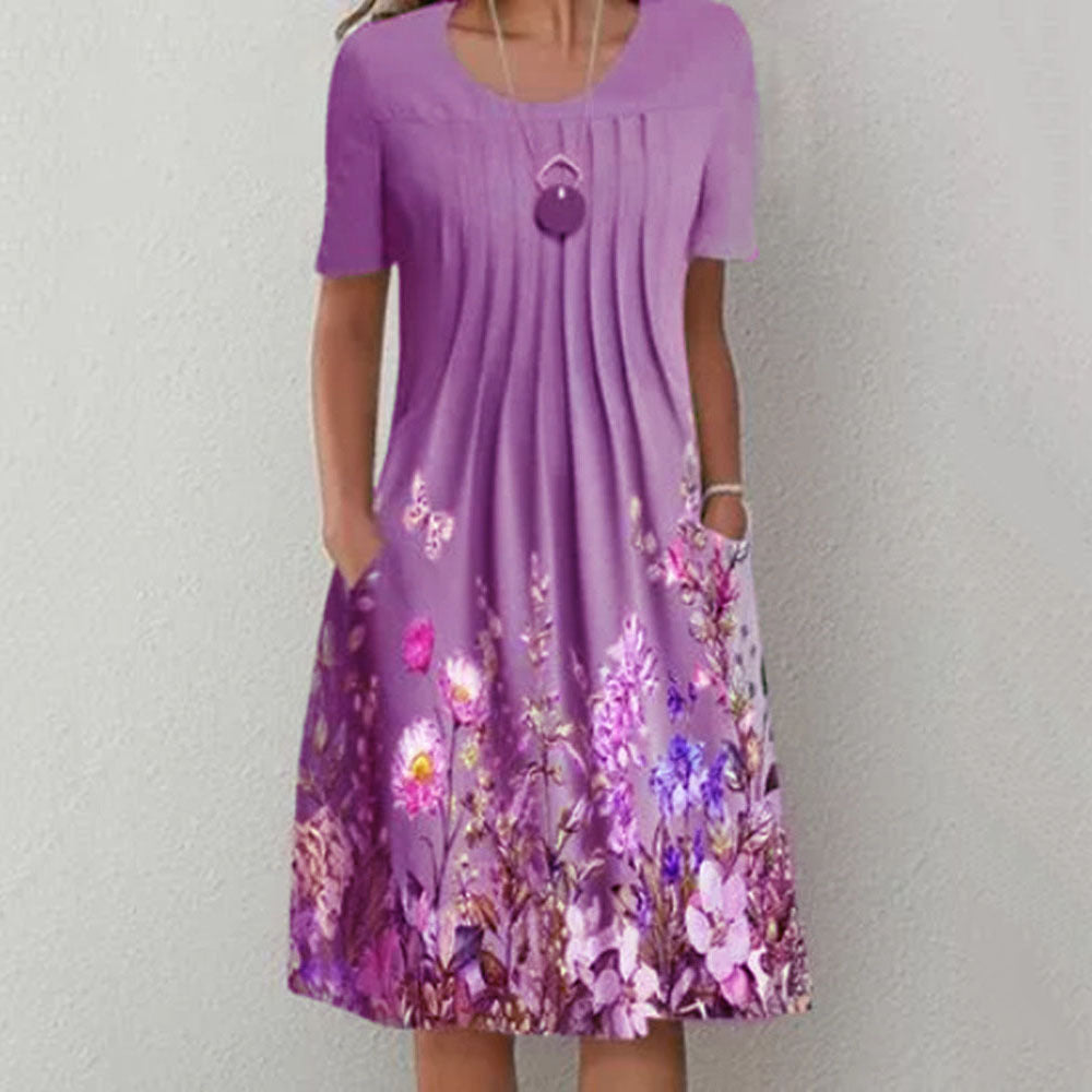 Damen Plissee Midi Kleid mit kurzen Ärmeln, seitlichen Taschen und floralem Saum Drune