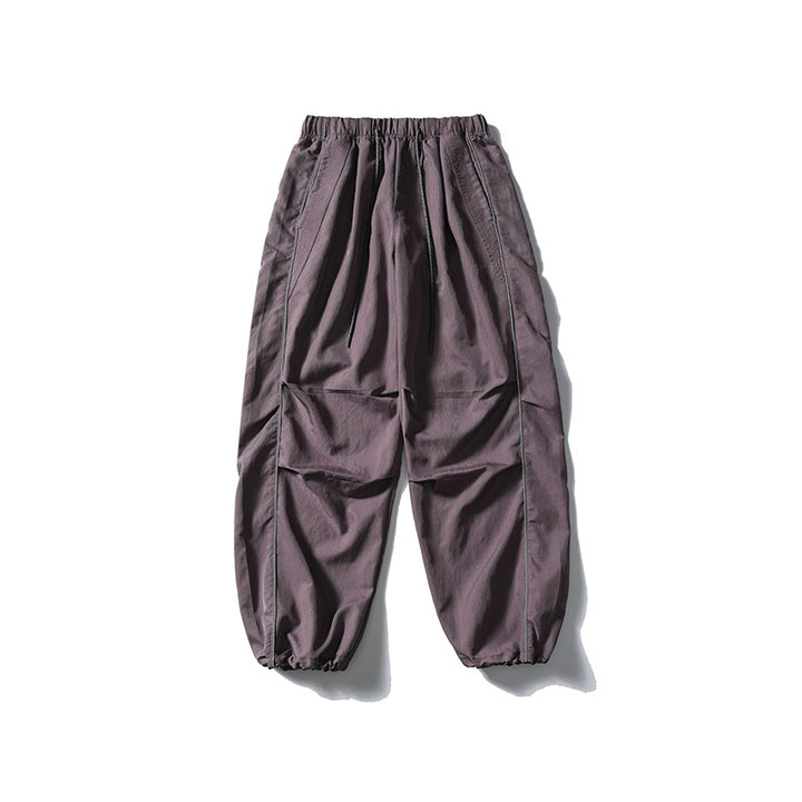 [Herren] weit geschnittene Nylon-Joggerhose im Utility-Stil mit Tunnelzugbund, Kontrastpaspel und elastischen Knöchelabschlüssen Drune