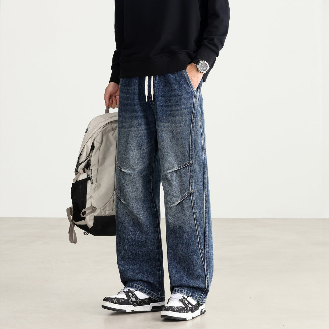 Herren Weite Denim-Hose mit Tunnelzugbund, Paneelnähten und Used-Waschung Drune