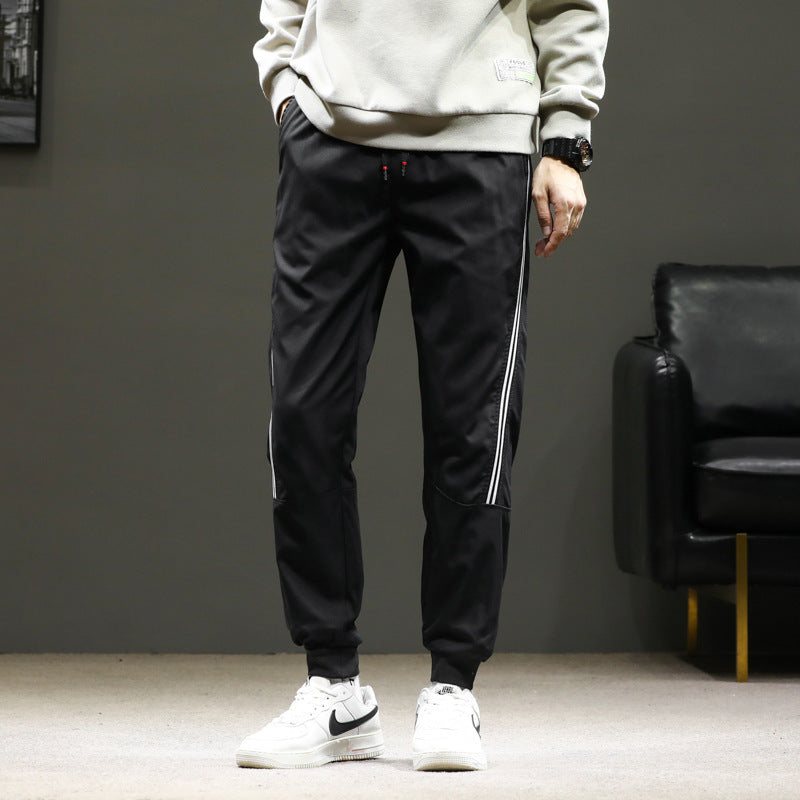 Herren Sportliche Nylon-Joggerhose mit elastischem Bund und seitlichen Kontraststreifen Drune