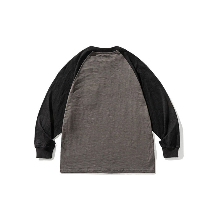 Unisex Lässiges Raglan-Longsleeve mit Kontrastärmeln und aufgesetzter Klappentasche Drune