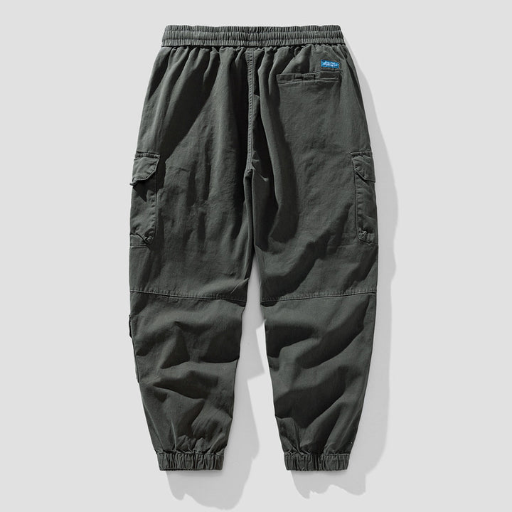 Herren Leichte Canvas-Cargohose im Joggerstil mit elastischem Bund, segmentierten Kniepaneelen und verdeckten Klappentaschen Drune