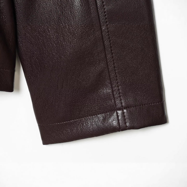 Damen Kurzjacke in veganer Lederoptik mit taillierendem Tunnelzug und Pattentaschen Drune