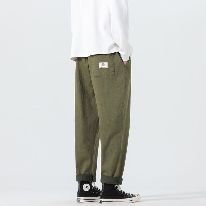 Herren Locker geschnittene Cropped-Denimhose mit Umschlag und Label-Patch Drune