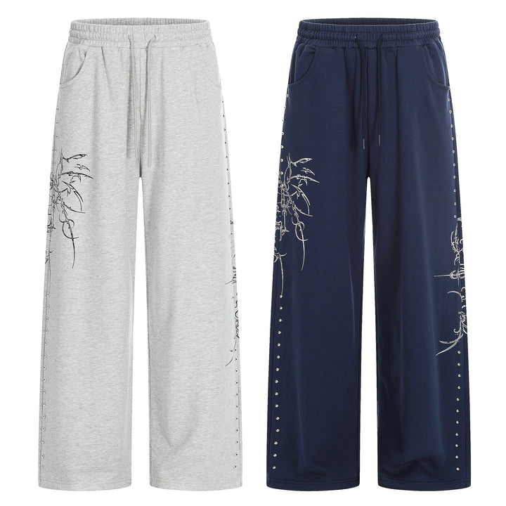 Damen Weite Sweatpants mit Tunnelzug, Ziernieten und grafischem Print Drune
