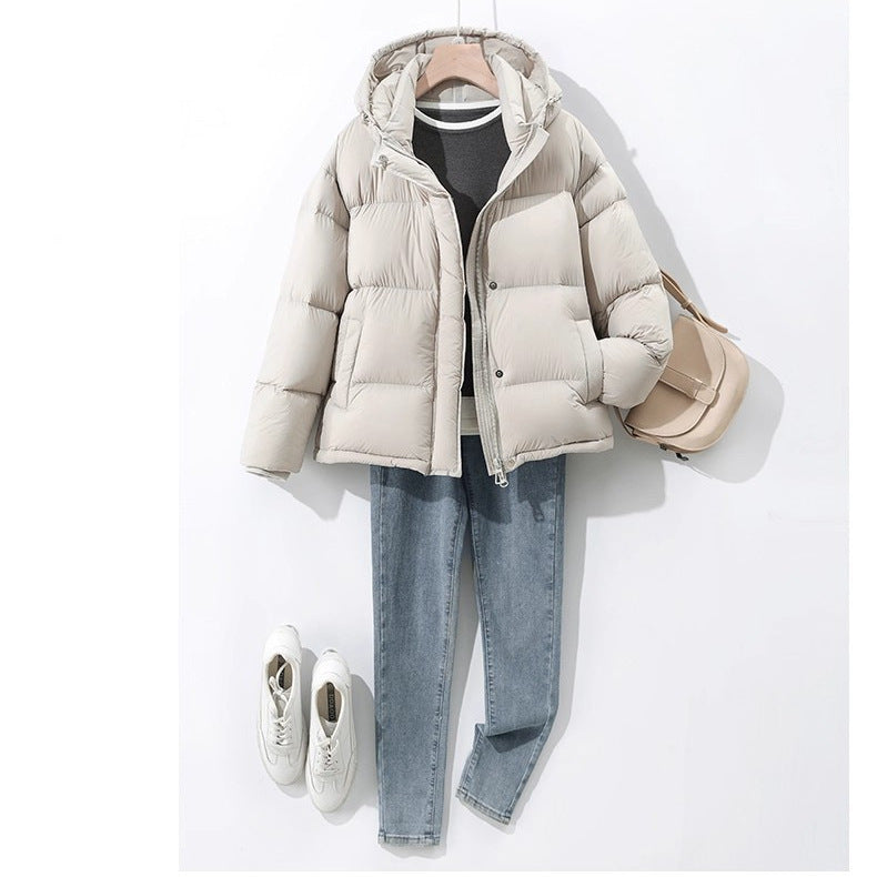 Damen Kurz geschnittene wattierte Kapuzenjacke mit Blocksteppung und Windschutzblende Drune