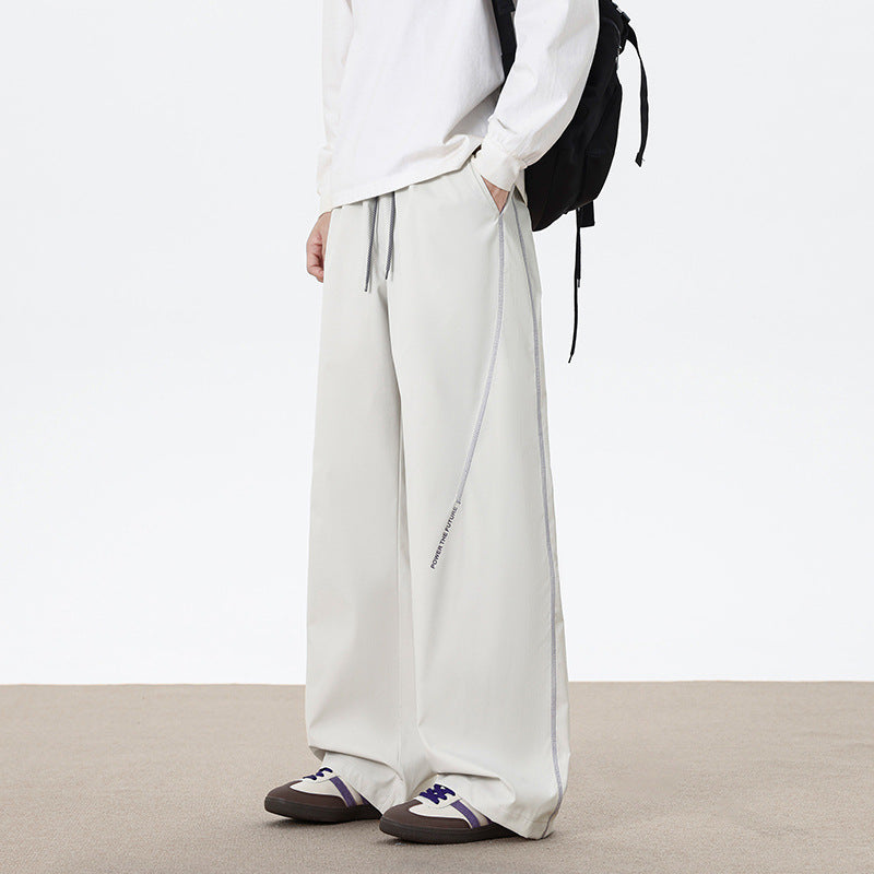 Herren Weitgeschnittene Sporthose mit reflektierenden Details