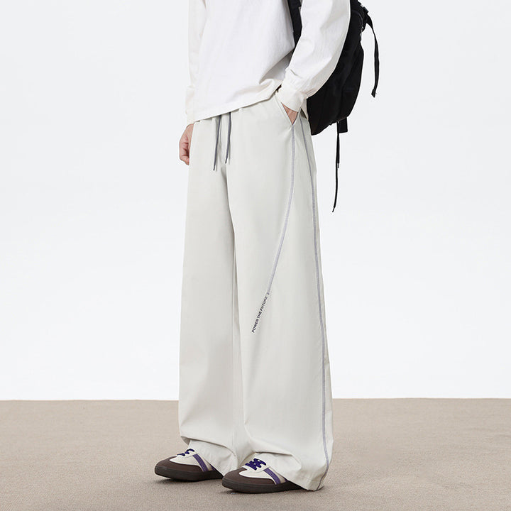 Herren Weitgeschnittene Sporthose mit reflektierenden Details