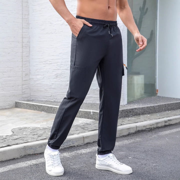 Herren Tech-Cargo-Jogginghose mit elastischem Tunnelzug, Reißverschluss‑Beintasche & eng anliegendem Fußbündchen Drune