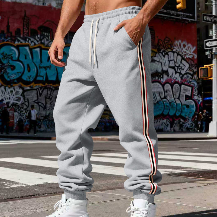 Herren Urbaner Slim-Jogger aus French Terry mit Seitenstreifen und gerippten Bündchen Drune