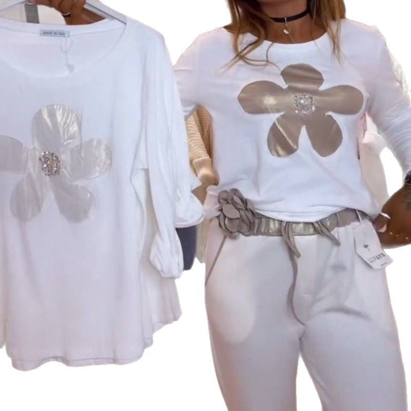 Damen nan locker geschnittenes Langarmshirt mit glänzender Blumenapplikation und Strassmitte Drune