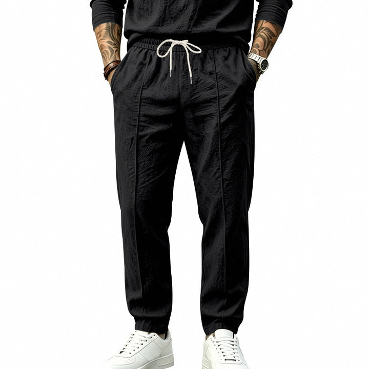 Herren Leichte Tapered-Jogginghose mit Bundfalten, elastischem Tunnelzug und Seitentaschen Drune