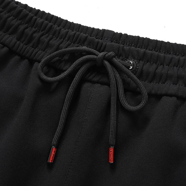Herren Sportliche konisch zulaufende Jogginghose mit Elastbund, Kordelzug & Reißverschlusstaschen Drune