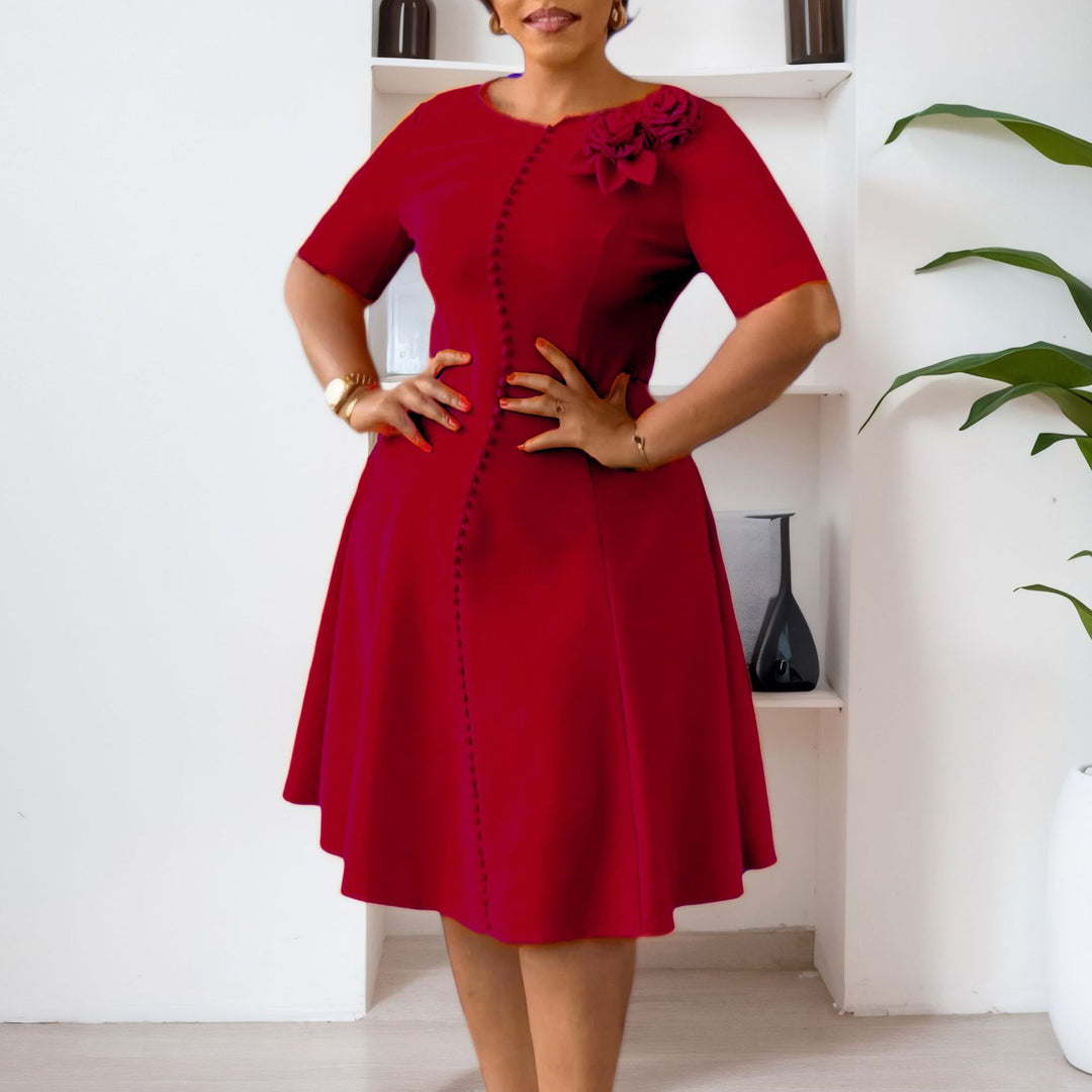 Damen A-Linien Kleid mit eleganten Knopfdetails und floralem Accessoire Drune