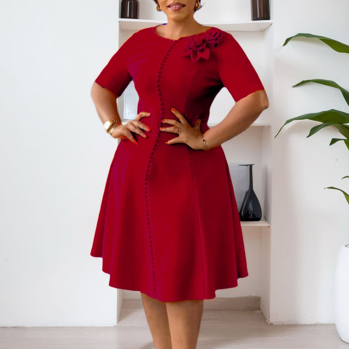 Damen A-Linien Kleid mit eleganten Knopfdetails und floralem Accessoire Drune