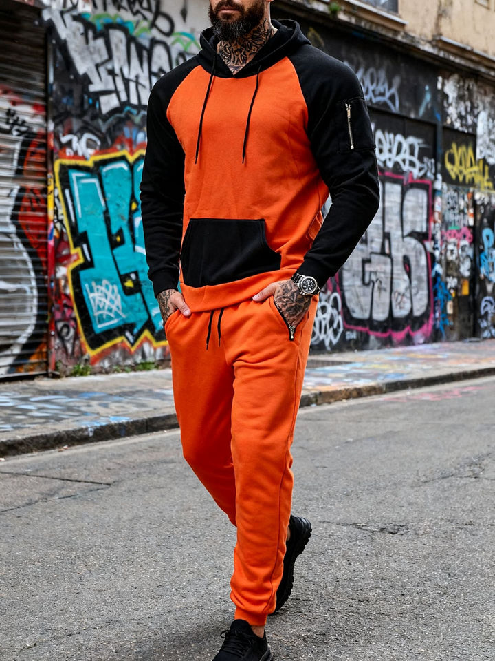 Herren nan zweiteiliges Kapuzen-Sweatset mit Raglanärmeln, Ärmel-Zip-Tasche und tapered Jogginghose Drune