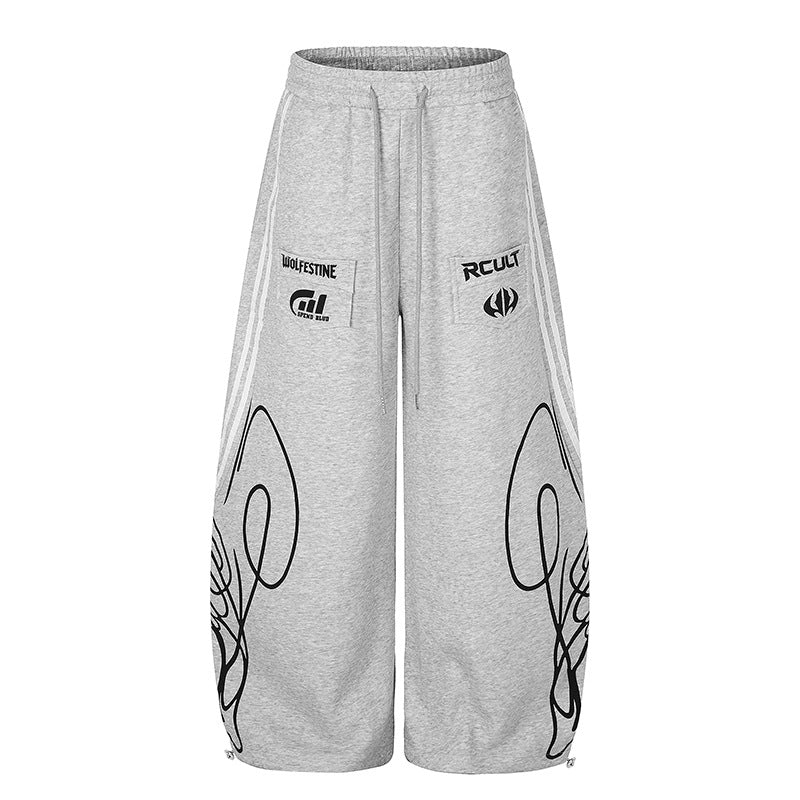 Damen Weite Midilounge‑Sweathose im Palazzo‑Cut mit Tunnelzug, Zip‑Saum und Statement‑Print Drune
