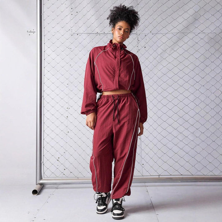 Damen sportives Cropped Windbreaker-Set mit Stehkragen Tunnelzug und reflektierenden Paspeln Drune