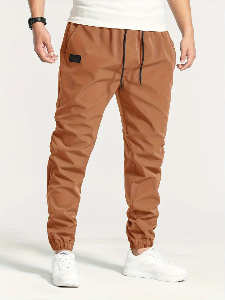 Herren Technische Jogginghose im Tapered‑Utility‑Stil mit elastischem Bund & Knöchelbündchen Drune
