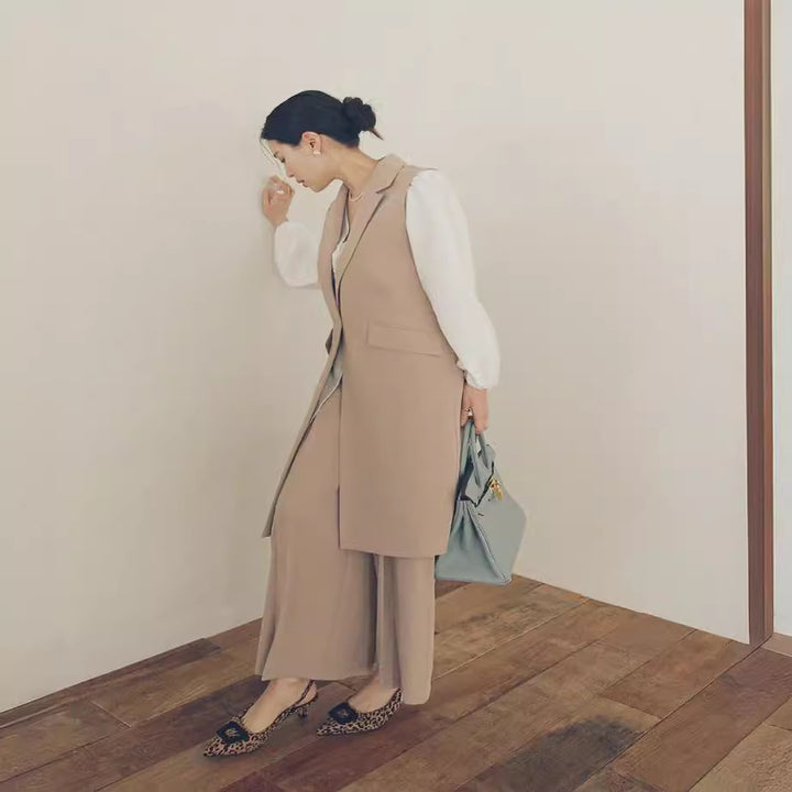 Damen Ärmellose Longweste im Tailoring mit Pattentaschen und einreihiger Knopfleiste Drune