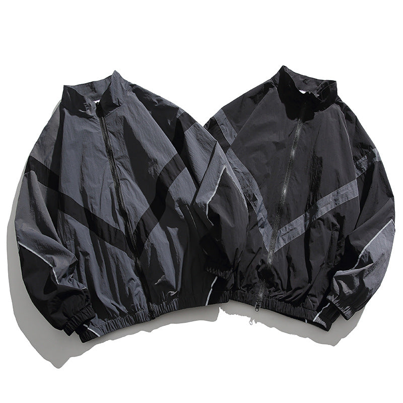 [Unisex] Oversize technische Wind- und Regenjacke mit Stehkragen, reflektierenden Paspeln und elastischem Saum Drune